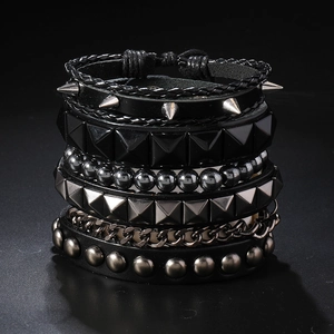 Punk style multi-layer bracelet set with black leather, metal spikes, and silver chains