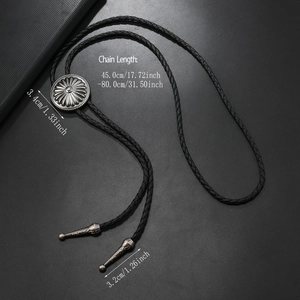 Detail view of flower-patterned alloy bolo tie buckle and metal tips with measurements