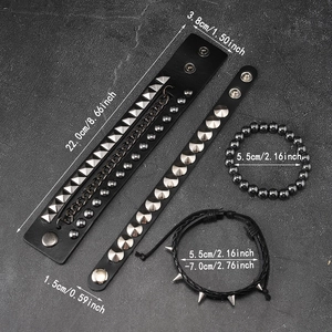 Detail view of 4-piece punk black leather bracelet set with metal studs and chains