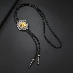 Cravate bolo western avec pendentif tête de cheval dorée sur cordon tressé noir
