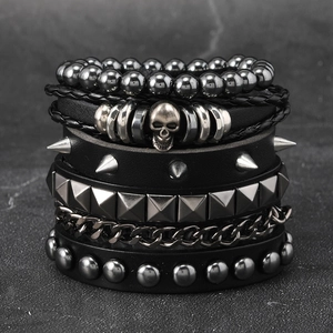 Detailed macro shot of punk multilayer leather bracelet with silver spikes and metal skull