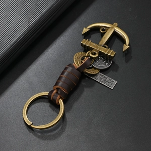 Retro bronze anchor keychain with dark brown leather wrap and vintage metal pendants