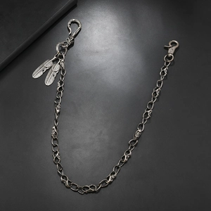 Men's punk skull hip hop waist chain with silver feathers and clasp on dark background