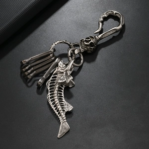 Gothic punk metal keychain featuring a skeleton fish bone pendant with vintage silver finish