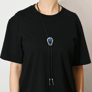 Vintage western bolo tie with blue marble stone on black braided leather cord