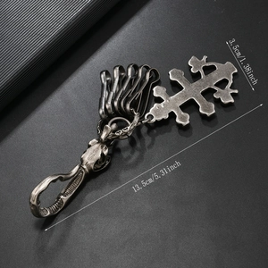 Detail showing vintage punk alloy cross keychain with dimensions of 13.5cm length