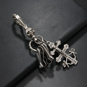 Vintage style skull keychain with Caravaca cross pendant in antique silver finish