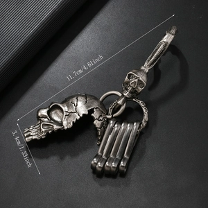 Vintage metal skull keychain with double skull pendants and snap hook for men and women