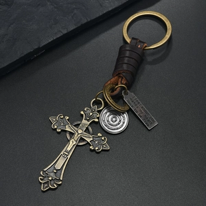 Vintage braided leather keychain with bronze crucifix cross and engraved inspirational metal tag