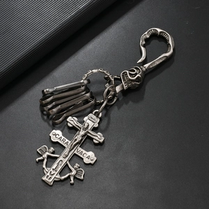 Gothic Caravaca cross keychain with skull and angel charms in vintage silver finish