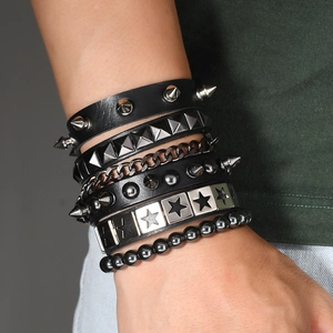 Detail shot of multi-layer punk bracelet set with leather studs and metal chains