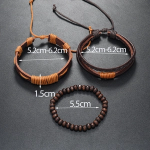 Close-up of men's leather bracelets set with wooden beads and woven cotton rope details