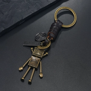 Porte-clés robot en bronze vintage avec lanière en cuir marron tressé à la main