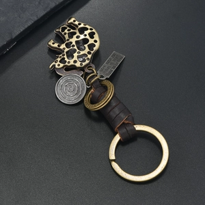 Retro bronze elephant keychain with braided leather strap and heart pattern engraving
