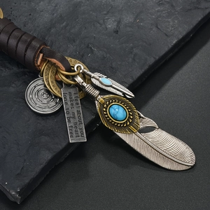 Retro leather keychain with silver feathers, turquoise bead and engraved metal plate