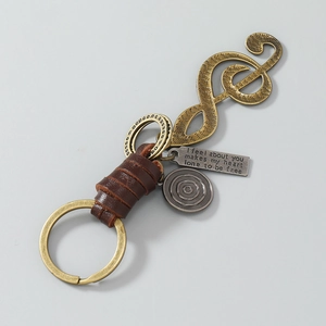 Vintage braided leather keychain with musical treble clef note and engraved metal pendant