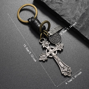 Detailed view of woven leather keychain with crucifix charm and 13.0cm size marking