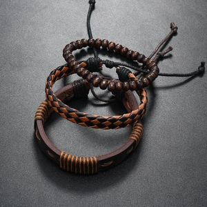 Detailed close-up of multilayer leather bracelets with wooden beads in retro ethnic style