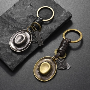 Retro western cowboy hat keychain with hand-woven leather strap and alloy pendant charm