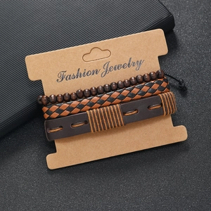 Close-up of three multilayered vintage leather bracelets on Fashion Jewelry card