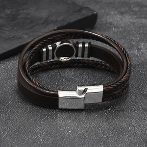 Close-up of men's multi-layer woven leather bracelet with magnetic steel clasp