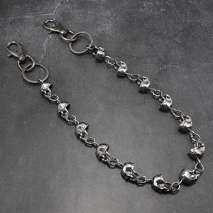 Detail of gunmetal skull link pants chain with lobster clasps for punk rock style