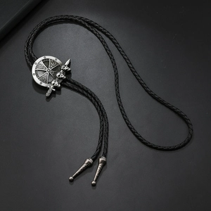 Vintage bolo tie met schedel en wapenschild in antiek zilver en zwarte gevlochten veter