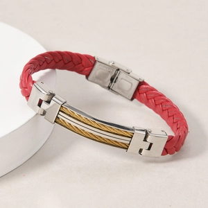 Macro detail of red woven leather bracelet with golden steel cable and stainless steel clasp