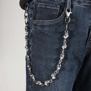 Hip hop skull trouser chain in vintage silver finish attached to blue jeans for men