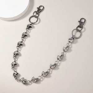 Detail of punk skull link chain in vintage silver finish with large lobster clasp