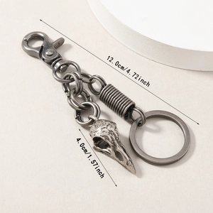 Retro silver alloy bird skull keychain showing dimensions of 12.0cm total length