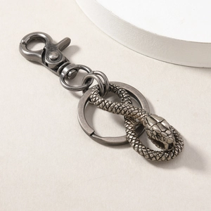 Vintage silver snake keychain with detailed scale texture on a flat ring clip