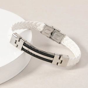 Detail view of white braided leather bracelet with stainless steel plate and wire inlay