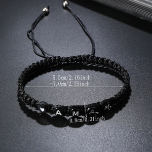 Detail of adjustable woven bracelet showing size dimensions and white letter beads