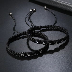 Adjustable black woven letter bracelet with AMAM WWJD beads and heart detail