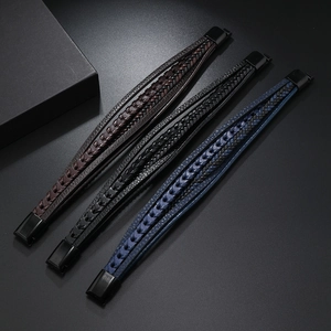 Detail view of multi-layer woven leather bracelets with matte black magnetic buckles
