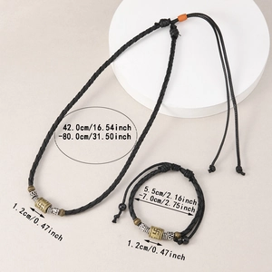 Detail of Tibetan style necklace and bracelet set with engraved metal mantra beads