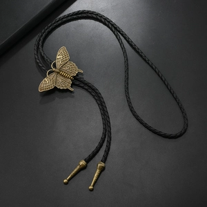 Vintage butterfly bolo tie necklace with antique brass pendant and black leather cord