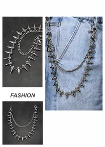 Detail view of punk double-layer metal wallet chain with silver spikes and skull motifs