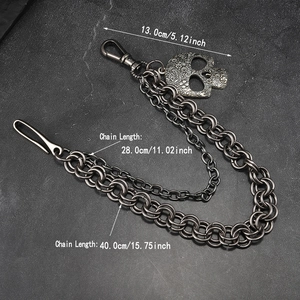 Detail view of double-layer punk wallet chain with skull charm and metal lobster clasps