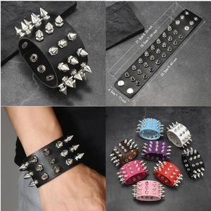 Detail of punk leather bracelet with three rows of silver spikes and adjustable snaps