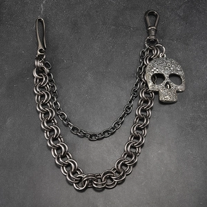 Double-layered gunmetal punk pants chain featuring a detailed floral engraved skull pendant