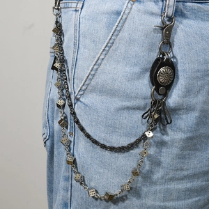 Punk style layered waist chain featuring dice pendants and leather concho accents