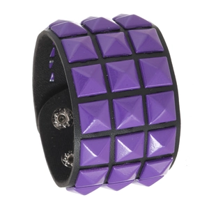 Punk style wide black leather bracelet featuring three rows of purple pyramid studs
