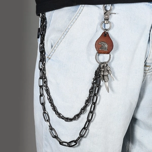 Detail of double-layer punk chain with eagle head leather patch and metal eagle claws