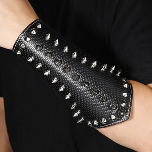 Punk black faux leather wristband with silver metal spikes and snake pattern texture