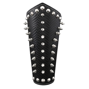 Punk black leather bracer with silver spikes and scales texture on white background