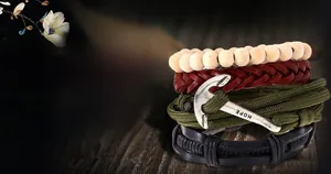Detail view of multi-layer leather bracelet set with anchor charm and wooden beads