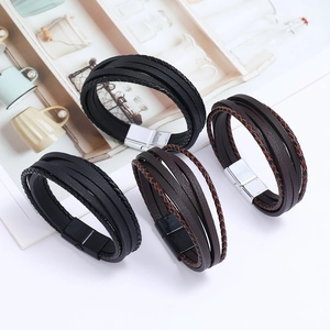 Détails de bracelets multicouches en cuir tressé noir et marron avec un fermoir magnétique