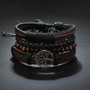 Vintage multi-layer braided leather bracelet set with tree of life charm on dark background